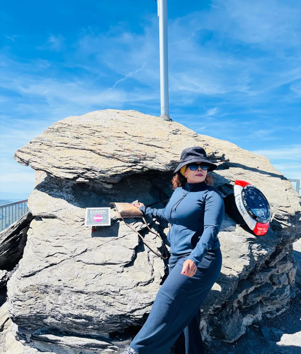 Dr. Alina visiting Glacier 3000 under a clear blue sky